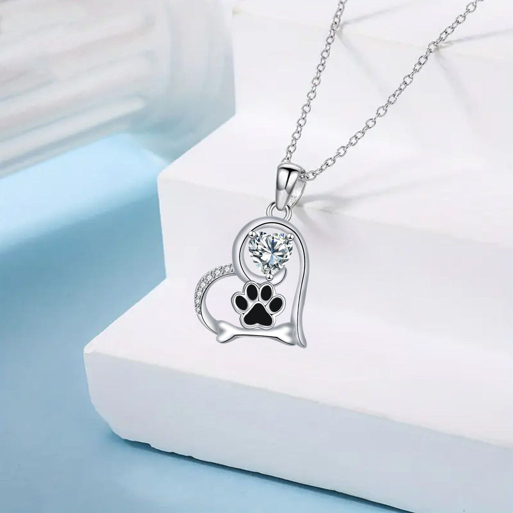 Collar artesanal con huella de pata de perro y hueso con circonitas