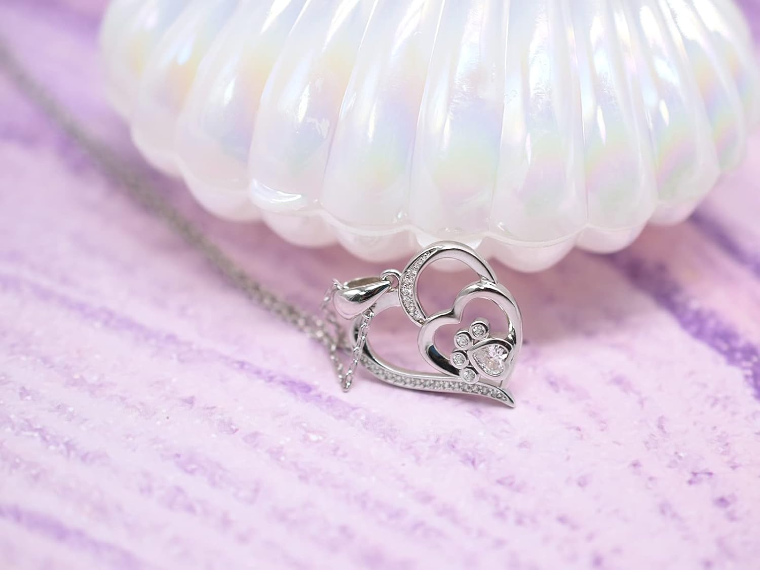 Collar de plata esterlina con huella de pata y corazón con zircones