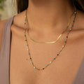 Collar vintage con piedras azules doradas