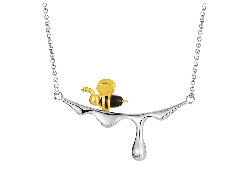 Collar con miel que gotea y una abeja