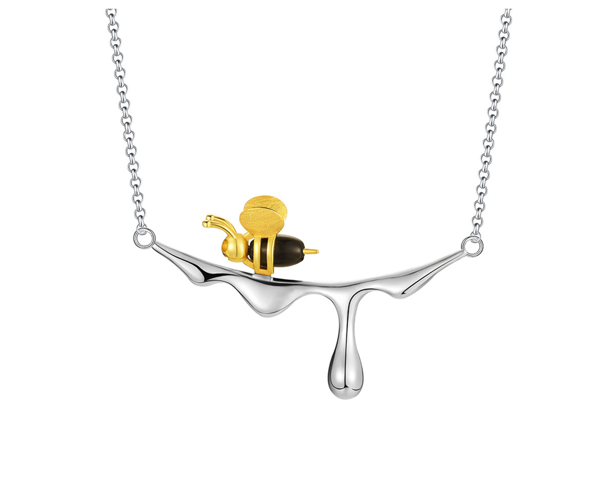 Collar con miel que gotea y una abeja