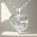 Collar de plata esterlina con huella de pata y corazón con zircones